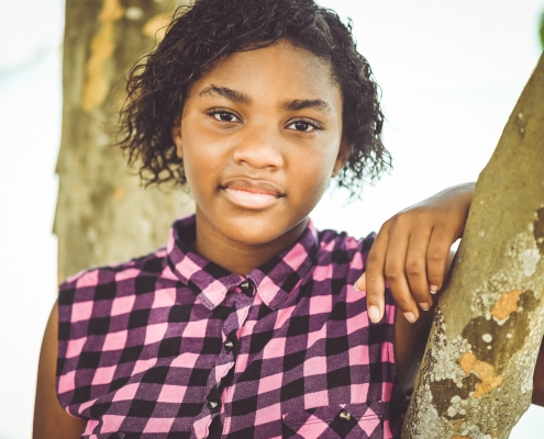 Natural and beautiful 13 year old African American teen in an outdoor portrait
